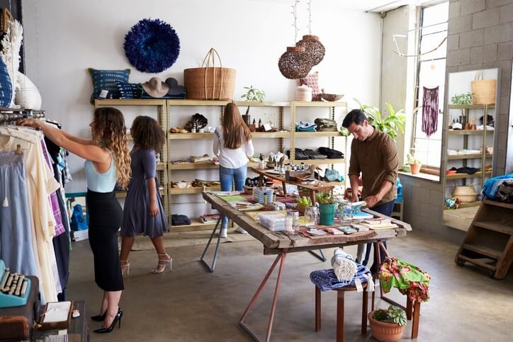 People shopping in a retail store with an open floor plan.