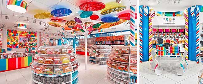 Group of colorful candy display cases with lollipop art.