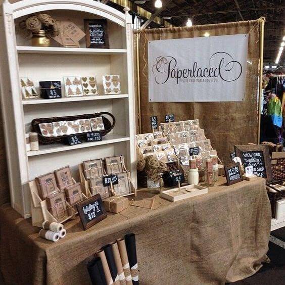 craft fair booth with multi-tiered risers