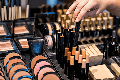 shopping at a cosmetic and lipstick display