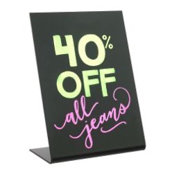 Chalkboard sign promoting "40% off all jeans" written in green and pink.