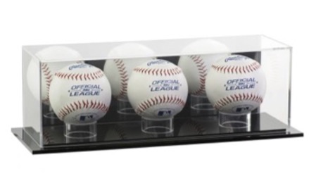 Three baseballs in a clear acrylic display case.