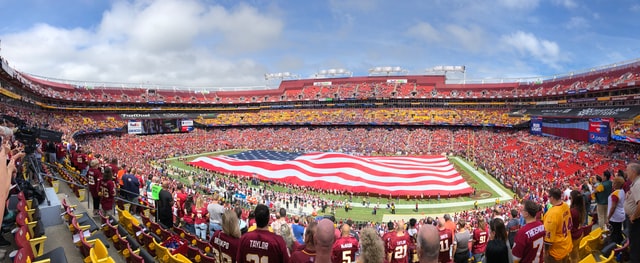 American football field with American Flag for National Anthem