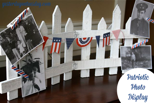Patriotic photo display on mini white picket fence.