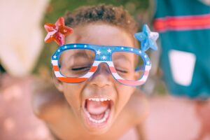 Young child with Patriotic Stars and Stripes Glasses