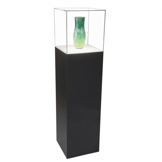 Gloss black lighted display pedestal with clear acrylic cover holding a green vase.