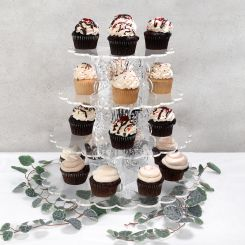 Tiered cupcake display stand with an assortment of cupcakes