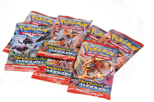 Assortment of packs of Pokemon trading cards.
