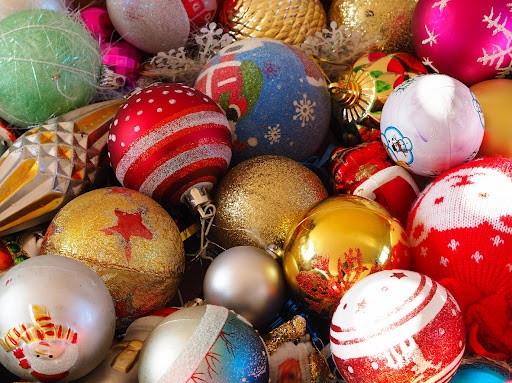 Assortment of colorful and unique Christmas ornaments in a pile.